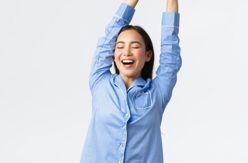 a woman with her arms in the air