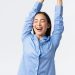 a woman with her arms in the air